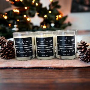 seasonal candles on table with pinecones