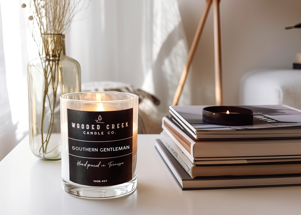 Southern Gentleman candle displayed on a white table