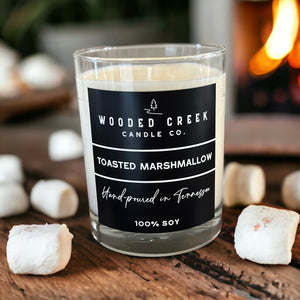 Toasted Marshmallow scented soy candle in a rustic setting